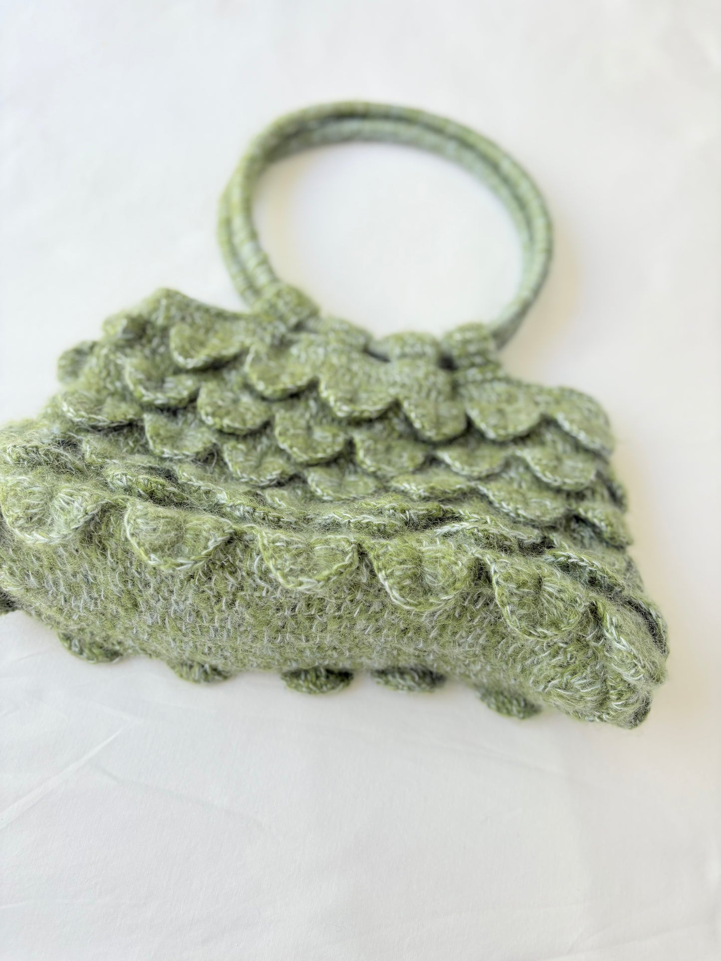 Scalloped green bag
